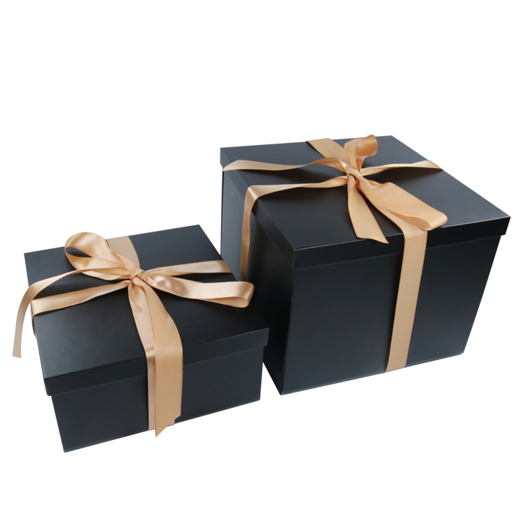 Black gift box with rose gold ribbon